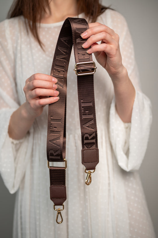 Plecu siksna ar logotipu Brūna